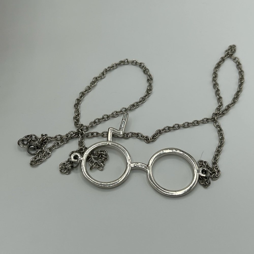 Harry Potter glasses and lightning bolt necklace